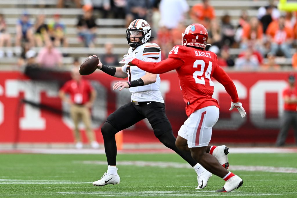 Nov 18, 2023; Houston, Texas, USA; Houston Cougars defensive back Adari Haulcy (24) applies pressure to Oklahoma State Cowboys quarterback Alan Bowman (7) during the first quarter at TDECU Stadium. Mandatory Credit: Maria Lysaker-USA TODAY Sports