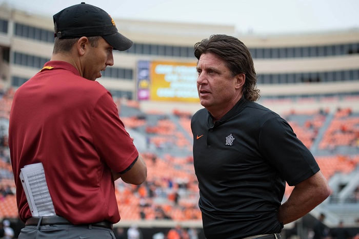 Oct 6, 2018; Stillwater, OK, USA; Iowa State Cyclones head coach Matt Campbell and Oklahoma State Cowboys head coach Mike Gundy (right) meet before a game at Boone Pickens Stadium. Mandatory Credit: Rob Ferguson-USA TODAY Sports