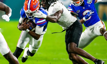 UCF Knights defensive back Corey Thornton (14) throws a face mask on Florida Gators quarterback Emory Jones (5). The Gators lead 10-9 over the Central Florida Knights at the half in the Gasparilla Bowl Thursday, December 23, 2021, at Raymond James Stadium in Tampa, FL. [Doug Engle/Ocala Star-Banner]2021