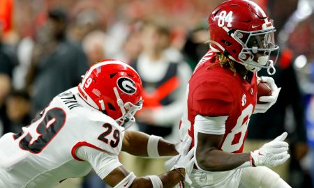 Georgia Bulldogs defensive back Christopher Smith (29) chases after Alabama Crimson Tide wide receiver Agiye Hall (84) on Monday, Jan. 10, 2022, during the College Football Playoff National Championship at Lucas Oil Stadium in Indianapolis.