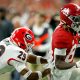 Georgia Bulldogs defensive back Christopher Smith (29) chases after Alabama Crimson Tide wide receiver Agiye Hall (84) on Monday, Jan. 10, 2022, during the College Football Playoff National Championship at Lucas Oil Stadium in Indianapolis.