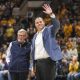 Dec 18, 2022; Morgantown, West Virginia, USA; West Virginia University President Gordon Gee welcomes new West Virginia Mountaineers Athletic Director Wren Baker during the first half against the Buffalo Bulls at WVU Coliseum. Mandatory Credit: Ben Queen-USA TODAY Sports