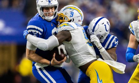 Dec 26, 2022; Indianapolis, Indiana, USA; Los Angeles Chargers linebacker Kenneth Murray Jr. (9) sacks Indianapolis Colts quarterback Nick Foles (9) in the first half at Lucas Oil Stadium. Mandatory Credit: Trevor Ruszkowski-USA TODAY Sports