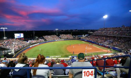 Fans watch the Women's College World Series softball game between Oklahoma and UCLA at the USA Softball Hall of Fame Stadium in Oklahoma City, Saturday, June 5, 2021, after storm caused a weather delay.