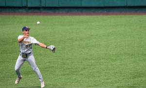 West Virginia infielder JJ Wetherholt (27) throws the ball to first during the game against the Texas Longhorns at UFCU Disch-Falk Field on Saturday, May 20, 2023 in Austin.