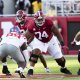 Sep 23, 2023; Tuscaloosa, Alabama, USA; Alabama Crimson Tide offensive lineman Tyler Booker (52) and Alabama Crimson Tide offensive lineman Kadyn Proctor (74) block against Mississippi at Bryant-Denny Stadium. Alabama defeated Mississippi 24-10. Mandatory Credit: Gary Cosby Jr.-USA TODAY Sports