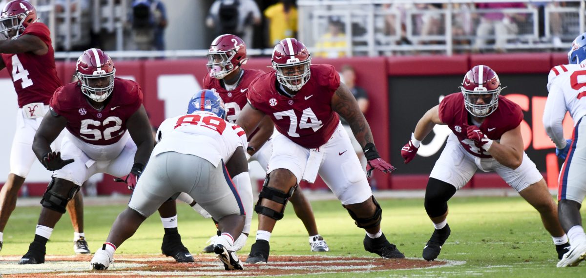 Sep 23, 2023; Tuscaloosa, Alabama, USA; Alabama Crimson Tide offensive lineman Tyler Booker (52) and Alabama Crimson Tide offensive lineman Kadyn Proctor (74) block against Mississippi at Bryant-Denny Stadium. Alabama defeated Mississippi 24-10. Mandatory Credit: Gary Cosby Jr.-USA TODAY Sports