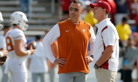 Oklahoma Sooners head coach Brent Venables, at right, and Texas Longhorns head coach Steve Sarkisian talk before the Red River Showdown college football game between the University of Oklahoma (OU) and Texas at the Cotton Bowl in Dallas, Saturday, Oct. 8, 2022.