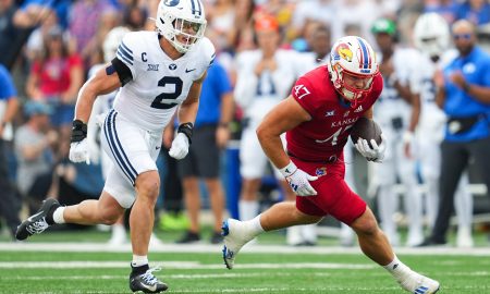 Sep 23, 2023; Lawrence, Kansas, USA; Kansas Jayhawks tight end Jared Casey (47) runs with the ball against Brigham Young Cougars linebacker Ben Bywater (2) during the first half at David Booth Kansas Memorial Stadium. Mandatory Credit: Jay Biggerstaff-USA TODAY Sports