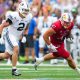 Sep 23, 2023; Lawrence, Kansas, USA; Kansas Jayhawks tight end Jared Casey (47) runs with the ball against Brigham Young Cougars linebacker Ben Bywater (2) during the first half at David Booth Kansas Memorial Stadium. Mandatory Credit: Jay Biggerstaff-USA TODAY Sports