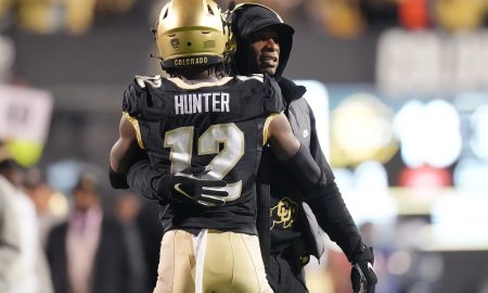 Oct 13, 2023; Boulder, Colorado, USA; Colorado Buffaloes wide receiver Travis Hunter (12) is congratulated for his touchdown by head coach Deion Sanders in the first quarter against the Stanford Cardinal at Folsom Field. Mandatory Credit: Ron Chenoy-USA TODAY Sports