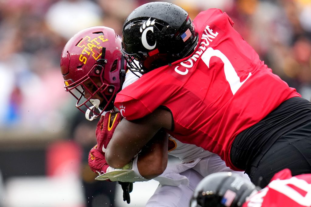 Cincinnati Bearcats defensive lineman Dontay Corleone (2) tackles Iowa State Cyclones running back Eli Sanders (6) in the fourth quarter during a college football game between the Iowa State Cyclones and the Cincinnati Bearcats Saturday, Oct. 14, 2023, at Nippert Stadium win Cincinnati. The Iowa State Cyclones won, 30-10.