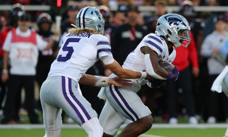 Oct 14, 2023; Lubbock, Texas, USA; Kansas State Wildcats quarterback Avery Johnson (5) hands the ball to running back DJ Giddens (31) in the first half during the game against the Texas Tech Red Raiders at Jones AT&T Stadium and Cody Campbell Field. Mandatory Credit: Michael C. Johnson-USA TODAY Sports