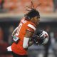 Oct 28, 2023; Stillwater, Oklahoma, USA; Oklahoma State Cowboys running back Ollie Gordon II (0) warms up before a game against the Cincinnati Bearcats at Boone Pickens Stadium. Mandatory Credit: Bryan Terry-USA TODAY Sports