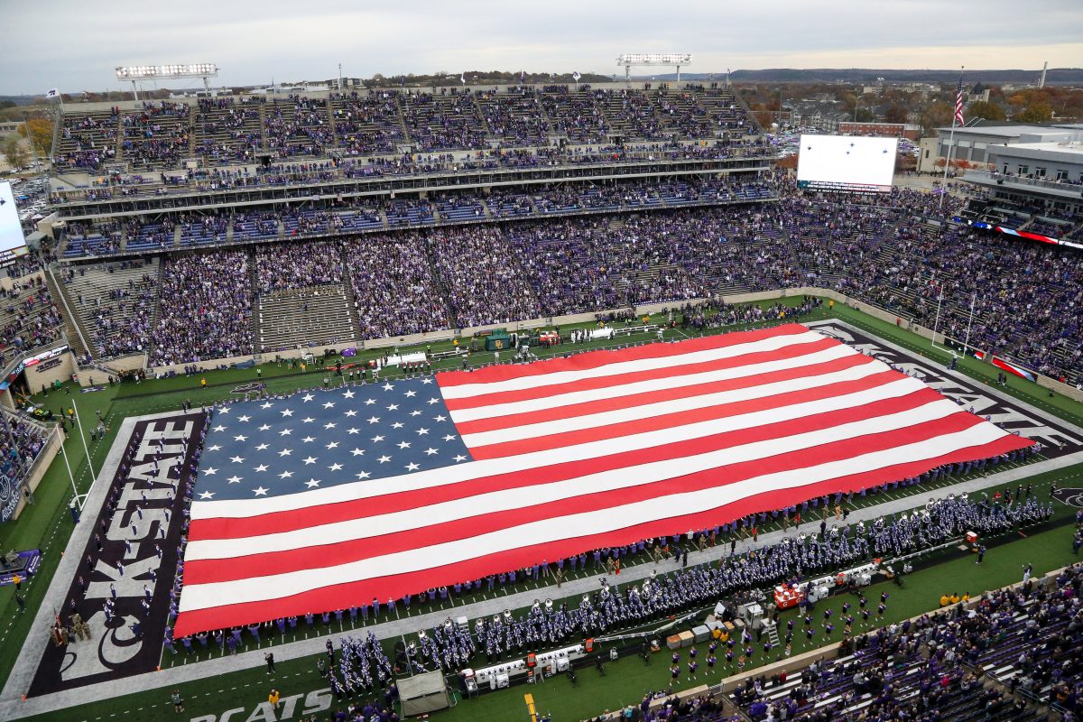 Nov 11, 2023; Manhattan, Kansas, USA; The American flag covers the field before the start of a game between the Baylor Bears and the Kansas State Wildcats at Bill Snyder Family Football Stadium. Mandatory Credit: Scott Sewell-USA TODAY Sports