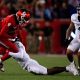 Cincinnati Bearcats cornerback Jordan Young (1) tackles Houston Cougars wide receiver Samuel Brown (4) in the fourth quarter of the NCAA football game between the Cincinnati Bearcats and the Houston Cougars TDECU Stadium in Houston, Texas, on Saturday, Nov. 11, 2023.