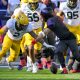 Nov 18, 2023; Fort Worth, Texas, USA; Baylor Bears linebacker Matt Jones (2) and TCU Horned Frogs quarterback Josh Hoover (10) battle for control of a fumble during the first half at Amon G. Carter Stadium. Mandatory Credit: Jerome Miron-USA TODAY Sports