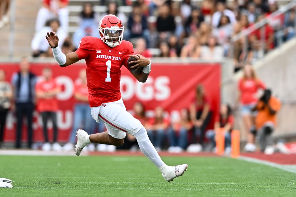 Nov 18, 2023; Houston, Texas, USA; Houston Cougars quarterback Donovan Smith (1) runs the ball during the first quarter against the Oklahoma State Cowboys at TDECU Stadium. Mandatory Credit: Maria Lysaker-USA TODAY Sports