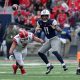 Nov 18, 2023; Tucson, Arizona, USA; Arizona Wildcats quarterback Noah Fifita (11) throws a pass against Utah Utes defensive end Van Fillinger (7) during the second half at Arizona Stadium. Mandatory Credit: Zachary BonDurant-USA TODAY Sports