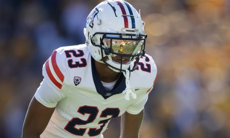 Nov 25, 2023; Tempe, Arizona, USA; An Arizona State Sun Devils player reflects in the helmet visor of Arizona Wildcats cornerback Tacario Davis (23) in the first half of the Territorial Cup at Mountain America Stadium. Mandatory Credit: Mark J. Rebilas-USA TODAY Sports