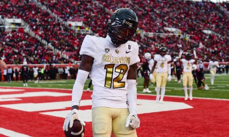 Nov 25, 2023; Salt Lake City, Utah, USA; Colorado Buffaloes athlete Travis Hunter (12) reacts after scoring a touchdown against the Utah Utes at Rice-Eccles Stadium. Mandatory Credit: Christopher Creveling-USA TODAY Sports