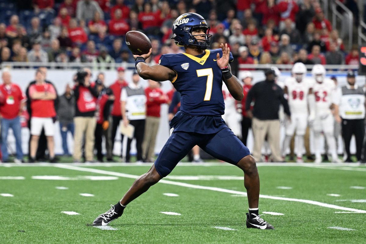 Dec 2, 2023; Detroit, MI, USA; Toledo Rockets quarterback Dequan Finn (7) throws a pass against the Miami (OH) Redhawks in the first quarter at Ford Field. Mandatory Credit: Lon Horwedel-USA TODAY Sports