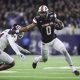 Dec 27, 2023; Houston, TX, USA; Oklahoma State Cowboys running back Ollie Gordon II (0) runs with the ball as Texas A&M Aggies linebacker Chris Russell Jr. (24) attempts to make a tackle during the first quarter at NRG Stadium. Mandatory Credit: Troy Taormina-USA TODAY Sports