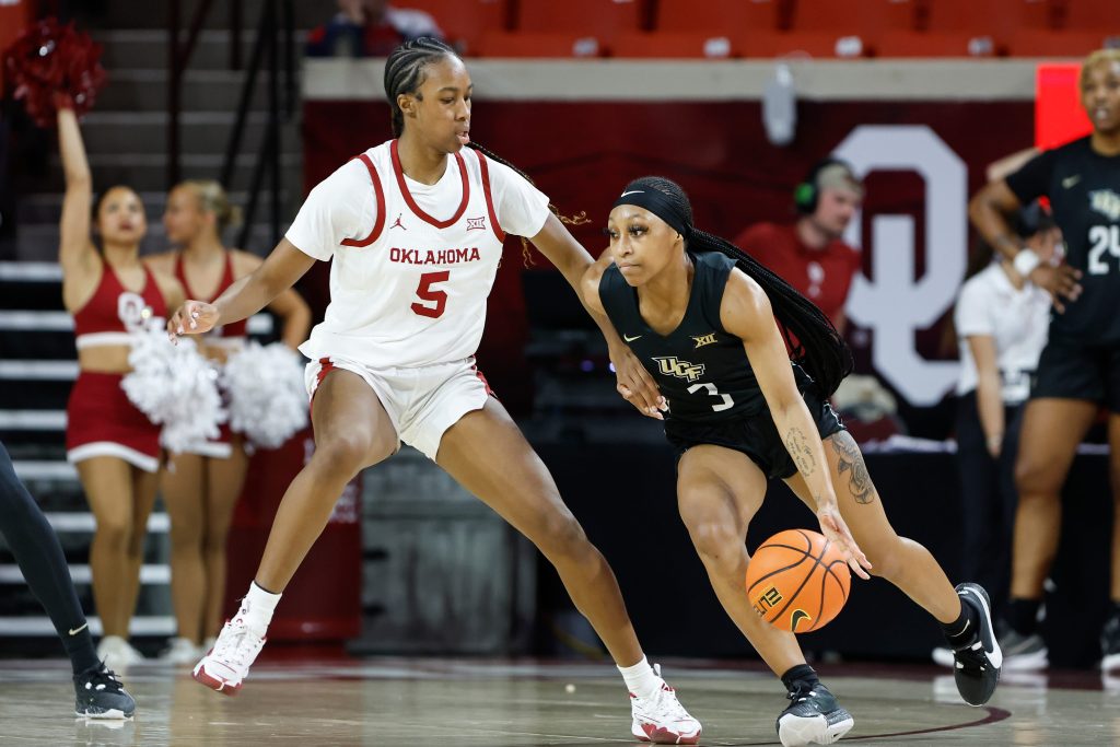 UCF Knights guard Kaitlin Peterson (3) moves around Oklahoma Sooners forward Kiersten Johnson (5) during the second half of an NCAA Women's Basketball game at Lloyd Noble Center in Norman, Okla., Saturday, Dec. 30, 2023. Oklahoma won 69-52.