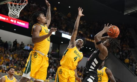 Jan 13, 2024; Waco, Texas, USA; Baylor Bears guard Langston Love (13) and guard Ja'Kobe Walter (4) defend Cincinnati Bearcats guard Jizzle James (2) during the first half at Paul and Alejandra Foster Pavilion. Mandatory Credit: Raymond Carlin III-USA TODAY Sports