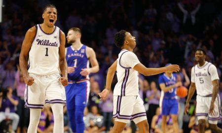 Kansas senior forward David N'Guessan (1) reacts alongside graduate senior guard Tylor Perry (2) after gaining a lead in the second half of the Sunflower Showdown inside Bramlage Coliseum Monday, February 5, 2024.