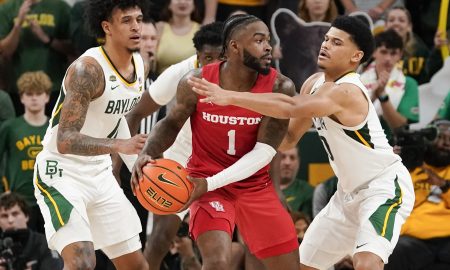 Feb 24, 2024; Waco, Texas, USA; Houston Cougars guard Jamal Shead (1) is guarded by Baylor Bears guard RayJ Dennis (10) during the second half at Paul and Alejandra Foster Pavilion. Mandatory Credit: Raymond Carlin III-USA TODAY Sports