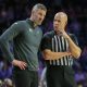 Feb 26, 2024; Manhattan, Kansas, USA; West Virginia Mountaineers interim head coach Josh Eilert listens to an official during overtime against the Kansas State Wildcats at Bramlage Coliseum. Mandatory Credit: Scott Sewell-USA TODAY Sports