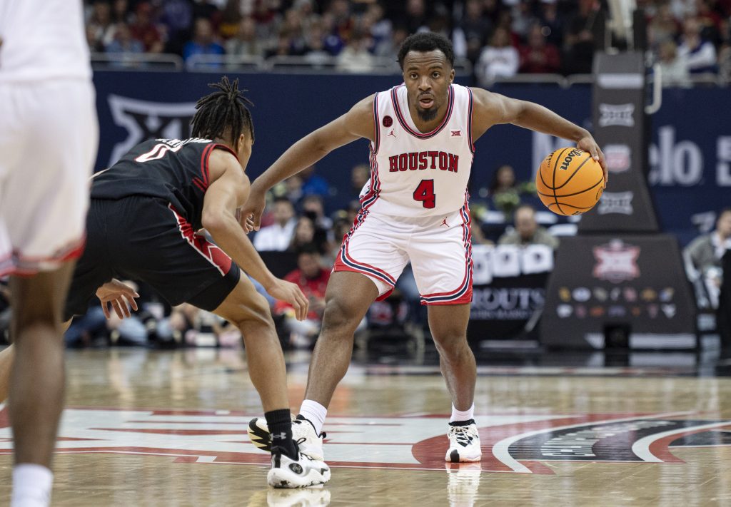 Mar 15, 2024; Kansas City, MO, USA; Houston Cougars guard LJ Cryer (4) controls the ball while defended by Texas Tech Red Raiders guard Chance McMillian (0) in the second half at T-Mobile Center. Mandatory Credit: Amy Kontras-USA TODAY Sports