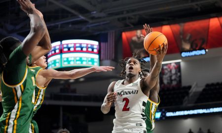 Cincinnati Bearcats guard Jizzle James (2) rises to the basket in the first half of a college basketball game against the San Francisco Dons in the National Invitation Tournament, Wednesday, March 20, 2024, at Fifth Third Arena in Cincinnati.