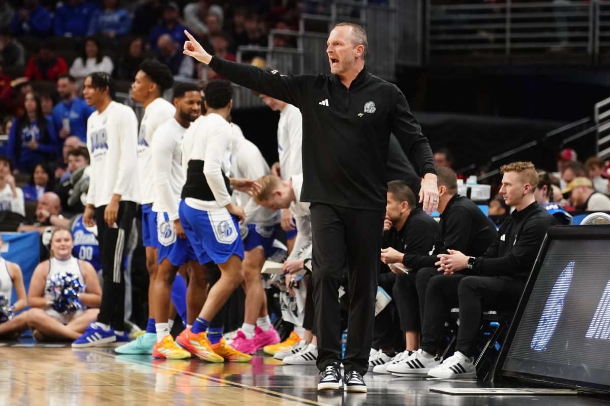 Mar 21, 2024; Omaha, NE, USA; Drake Bulldogs head coach Darian DeVries reacts in the first half against the Washington State Cougars in the first round of the 2024 NCAA Tournament at CHI Health Center Omaha. Mandatory Credit: Dylan Widger-USA TODAY Sports