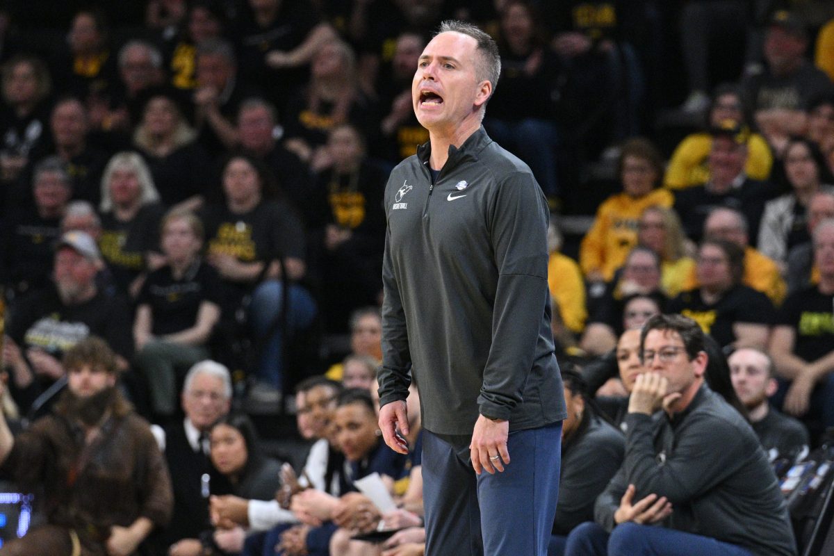 Mar 25, 2024; Iowa City, IA, USA; West Virginia Mountaineers head coach Mark Kellogg reacts during the second quarter against the Iowa Hawkeyes of the NCAA second round game at Carver-Hawkeye Arena. Mandatory Credit: Jeffrey Becker-USA TODAY Sports