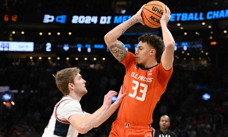 Mar 30, 2024; Boston, MA, USA; Illinois Fighting Illini forward Coleman Hawkins (33) attempts to dribble against the Connecticut Huskies in the finals of the East Regional of the 2024 NCAA Tournament at TD Garden. Mandatory Credit: Brian Fluharty-USA TODAY Sports