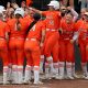 Oklahoma State's Caroline Wang (66) celebrates as she comes home after hitting a three-run home run in the first inning of a college softball game between the Oklahoma State University Cowgirls and the Texas Longhorns in Stillwater, Okla., Saturday, March 30, 2024. Oklahoma State won 3-0.