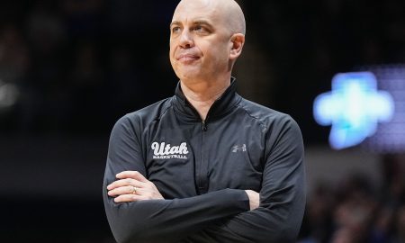 Utah Utes head coach Craig Smith watches the game from the sidelines Tuesday, April 2, 2024, during the NIT semifinals at Hinkle Fieldhouse in Indianapolis. The Indiana State Sycamores defeated the Utah Utes, 100-90.