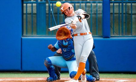 Texas utility Reese Atwood (14) hits a double during the Big 12 softball tournament game between the Texas Longhorns and the Kansas Blue Jays at USA Softball Hall of Fame Stadium in Oklahoma City, on Friday, May 12, 2023.