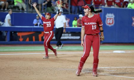 Oklahoma's Nicole May (19) and Alyssa Brito (33) celebrate after the Big 12 softball tournament championship game between the University of Oklahoma Sooners (OU) and Texas Longhorns at Devon Park in Oklahoma City, Saturday, May 11, 2024. Oklahoma won 5-1.