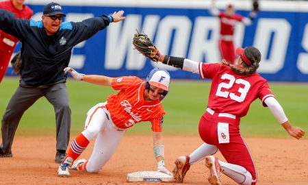 Florida outfielder Korbe Otis (33) slides into second base safe as Oklahoma second baseman Tiare Jennings (23) attempts to tag out during a Women’s College World Series semifinal game between Oklahoma (OU) and Florida at Devon Park in Oklahoma City, on Monday, June 3, 2024.