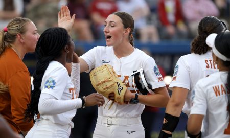 Texas pitcher Teagan Kavan (17) celebrates after an inning during a Women's College World Series semifinal softball game between the Stanford Cardinal and the Texas Longhorns at Devon Park in Oklahoma City, Monday, June 3, 2024. Texas won 1-0.