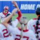 Oklahoma catcher Kinzie Hansen (9) hits a home run in the third inning of the first game of the Women’s College World Series softball championship series between the Oklahoma Sooners and the Texas Longhorns at Devon Park in Oklahoma City on Wednesday, June 5, 2024.