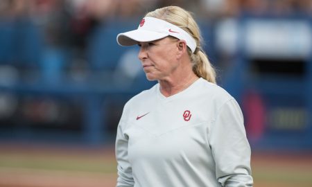 Jun 6, 2024; Oklahoma City, OK, USA; Oklahoma Sooners head coach Patty Gasso looks on in the second inning against the Texas Longhorns during game two of the Women's College World Series softball championship finals at Devon Park. Mandatory Credit: Brett Rojo-USA TODAY Sports