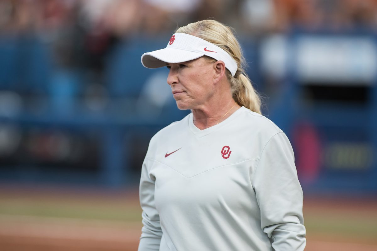 Jun 6, 2024; Oklahoma City, OK, USA; Oklahoma Sooners head coach Patty Gasso looks on in the second inning against the Texas Longhorns during game two of the Women's College World Series softball championship finals at Devon Park. Mandatory Credit: Brett Rojo-USA TODAY Sports