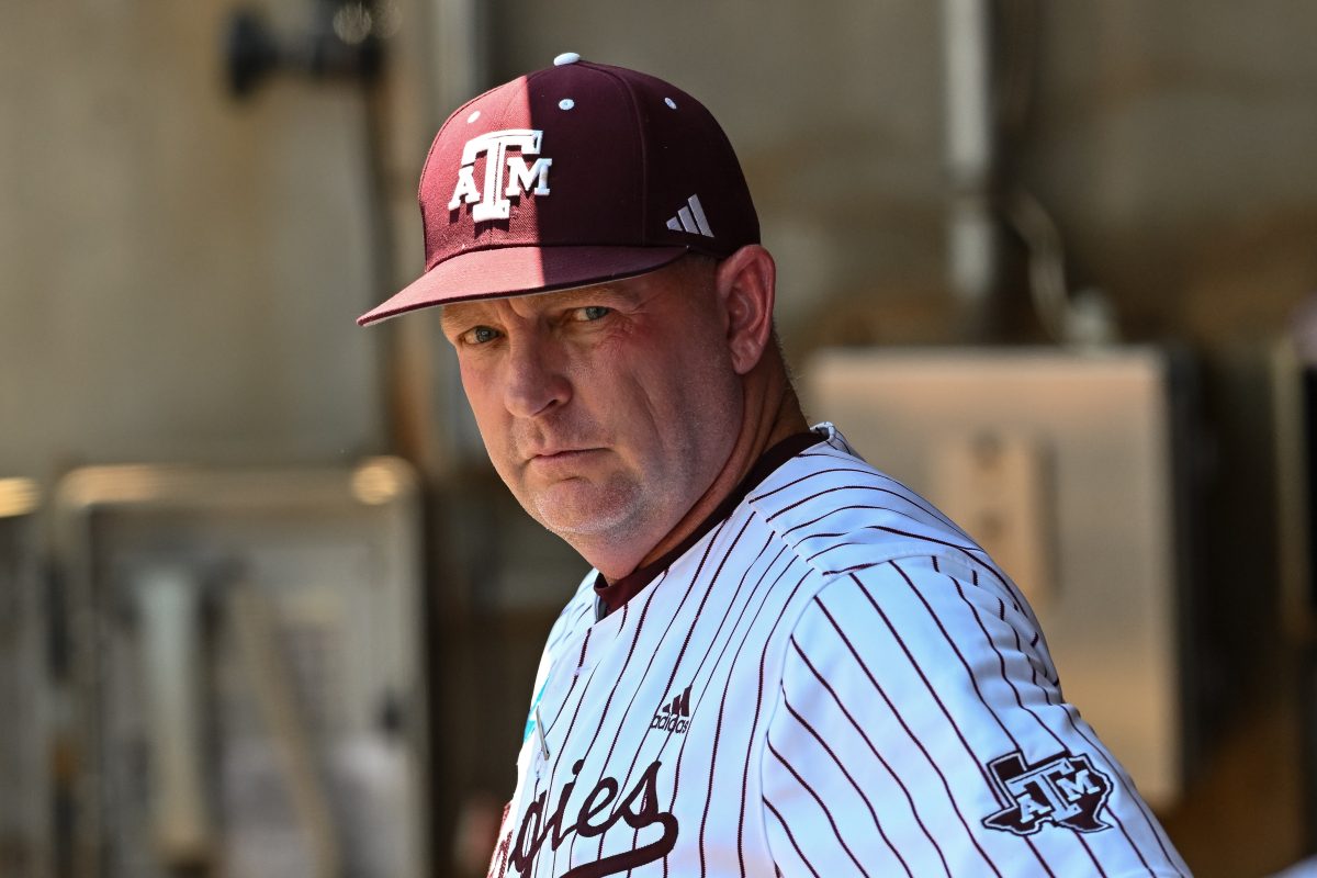 Jun 8, 2024; College Station, TX, USA; Texas A&M head coach Jim Schlossnagle looks on from the dugout prior to the game against the Oregon at Olsen Field, Blue Bell Park Mandatory Credit: Maria Lysaker-USA TODAY Sports