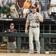 Jun 24, 2024; Omaha, NE, USA; Texas A&M Aggies head coach Jim Schlossnagle signals the umpire against the Tennessee Volunteers during the ninth inning at Charles Schwab Field Omaha. Mandatory Credit: Steven Branscombe-USA TODAY Sports