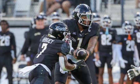 Aug 29, 2024; Orlando, Florida, USA; UCF Knights quarterback KJ Jefferson (1) hands off to running back RJ Harvey (7) during the first quarter against the New Hampshire Wildcats at FBC Mortgage Stadium. Mandatory Credit: Mike Watters-USA TODAY Sports