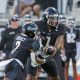 Aug 29, 2024; Orlando, Florida, USA; UCF Knights quarterback KJ Jefferson (1) hands off to running back RJ Harvey (7) during the first quarter against the New Hampshire Wildcats at FBC Mortgage Stadium. Mandatory Credit: Mike Watters-USA TODAY Sports